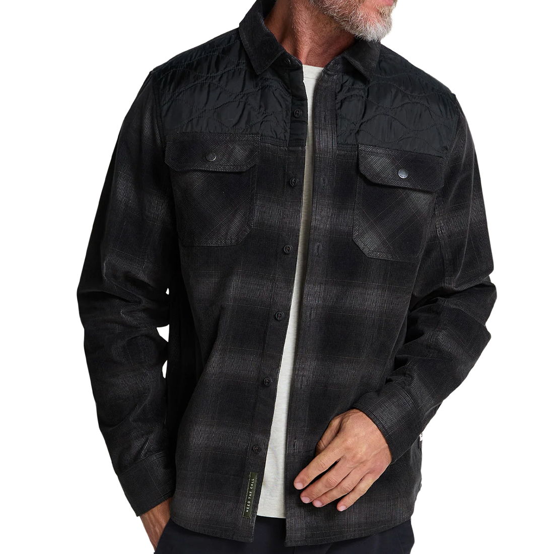 Man on the beach at dusk wearing the Emmett Plaid Nightshade Quintana Quilted Shirt as a light layer, The Simple Man