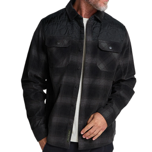 Man on the beach at dusk wearing the Emmett Plaid Nightshade Quintana Quilted Shirt as a light layer, The Simple Man
