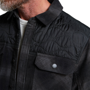 Close-up of the corduroy texture, quilted nylon yoke and Howler Bros snap chest pocket on the Quintana Quilted Shirt, The Simple Man