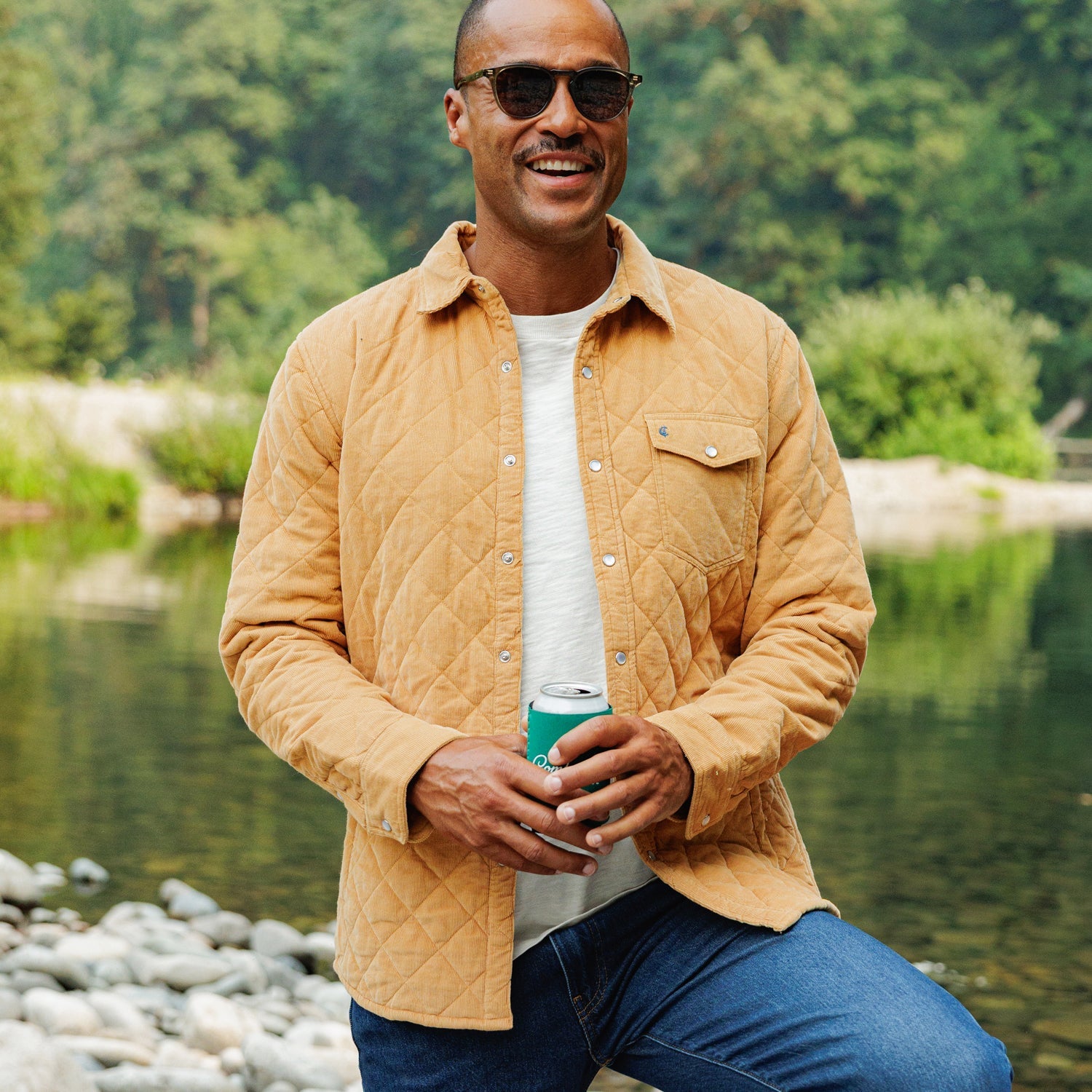 Man wearing Corduroy Quilted Shacket in Camel by a river, snap front and chest pocket - The Simple Man