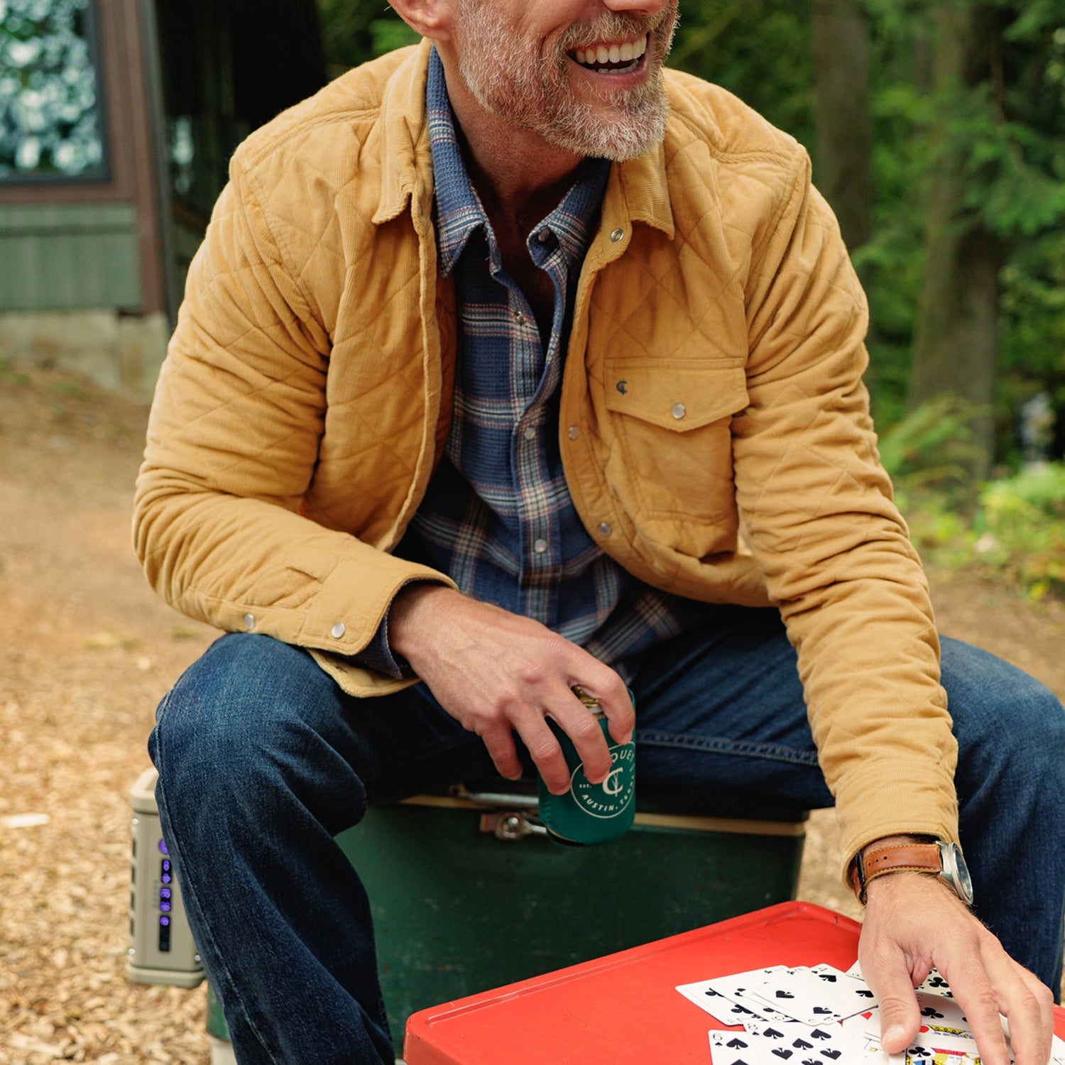 Man sitting in Corduroy Quilted Shacket in Camel over a plaid shirt - The Simple Man