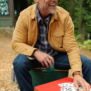 Man sitting in Corduroy Quilted Shacket in Camel over a plaid shirt - The Simple Man