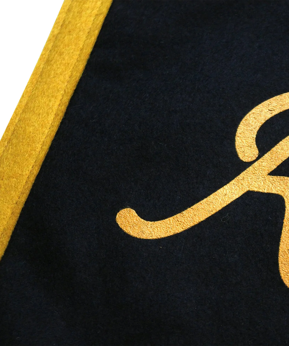 Raise Hell Kid mini camp flag close-up of gold stitched lettering and felt binding, The Simple Man
