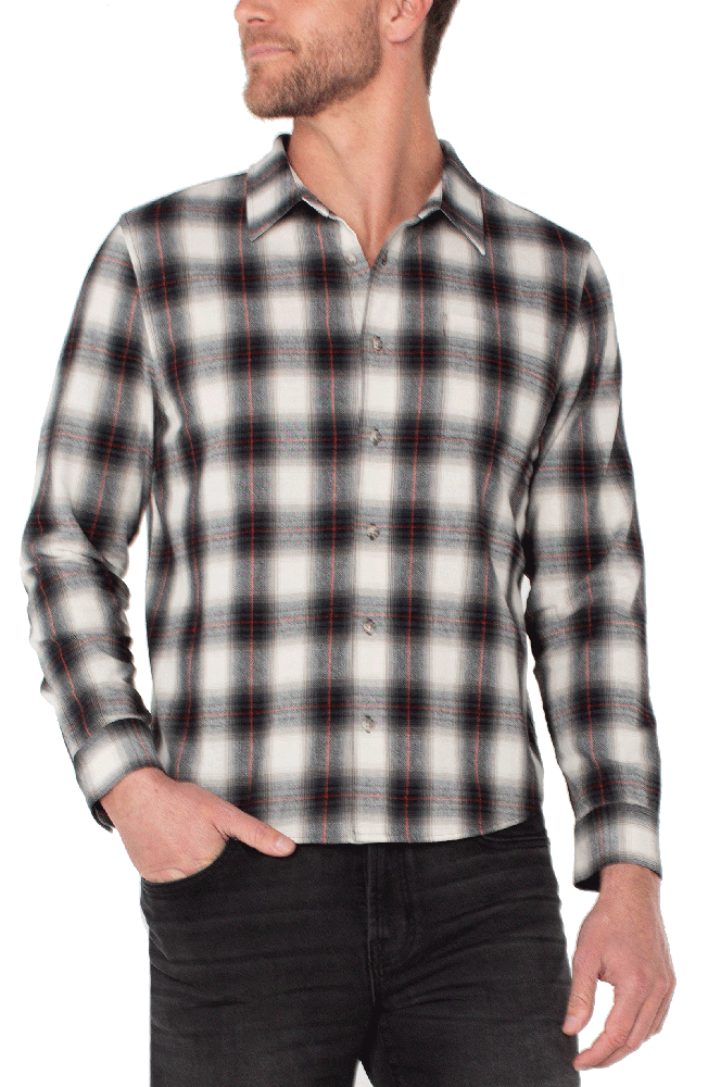 Man wearing brushed cotton Red / Black /White plaid button-up shirt with long sleeves and black jeans – rugged men’s fall shirt from The Simple Man.