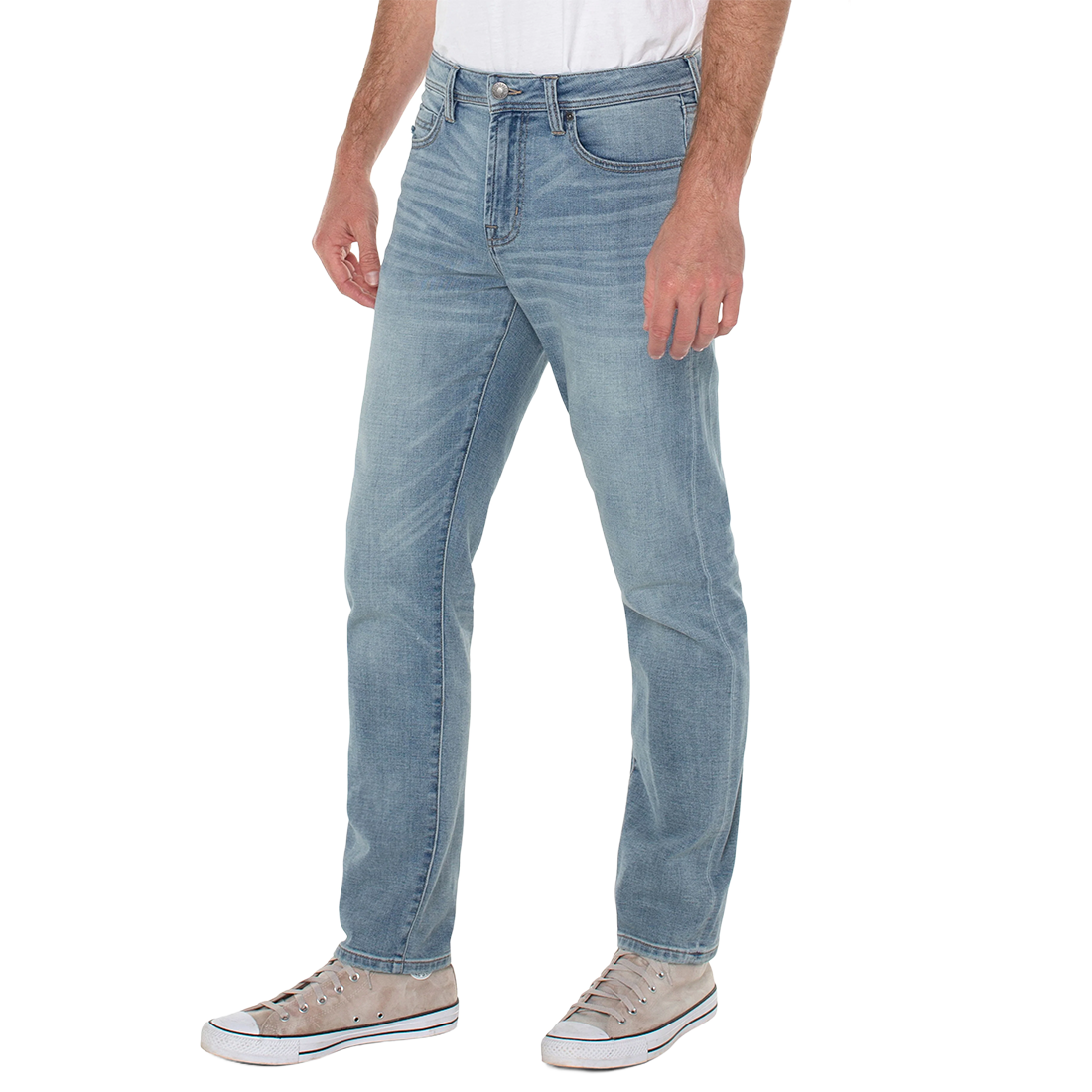 Three-quarter view on model of Palos Verdes wash relaxed straight jeans with a white tee and canvas sneakers