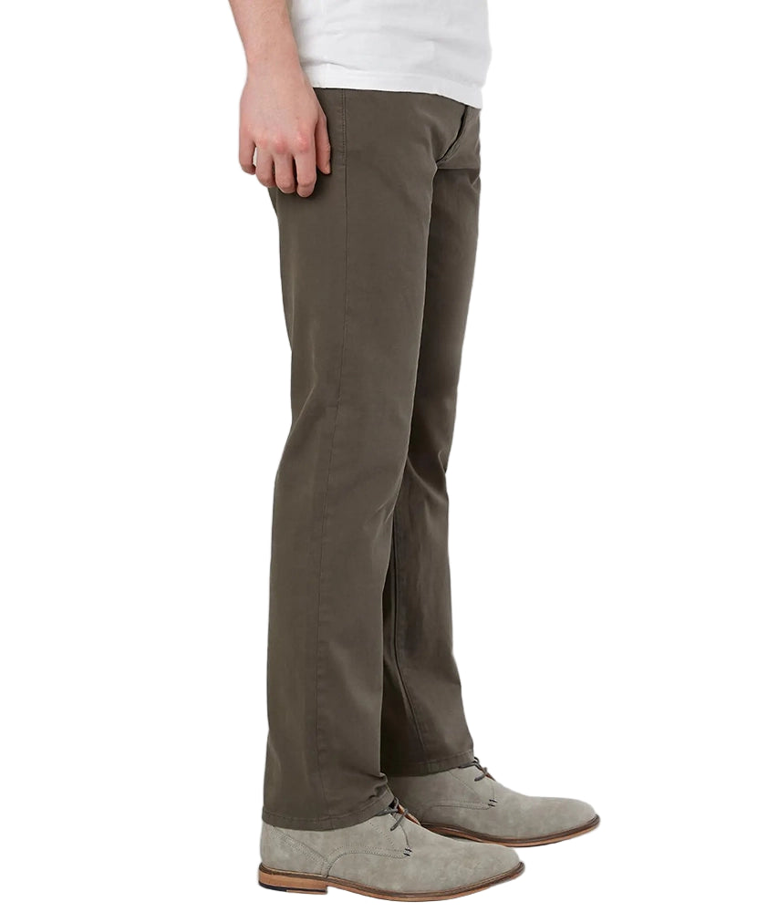 Side view of Regent Relaxed Straight Jeans in Deep Earth, styled with grey suede boots – classic men’s straight-leg knit denim pants from The Simple Man