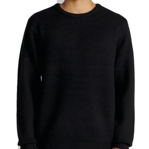 Man wearing the Rivers Sweater in Black, front view with jeans