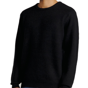 Man wearing the Rivers Sweater in Black, side view
