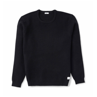 Rivers Sweater in Black, flat lay front view of a classic fit crew neck with a woven patch label at the hem