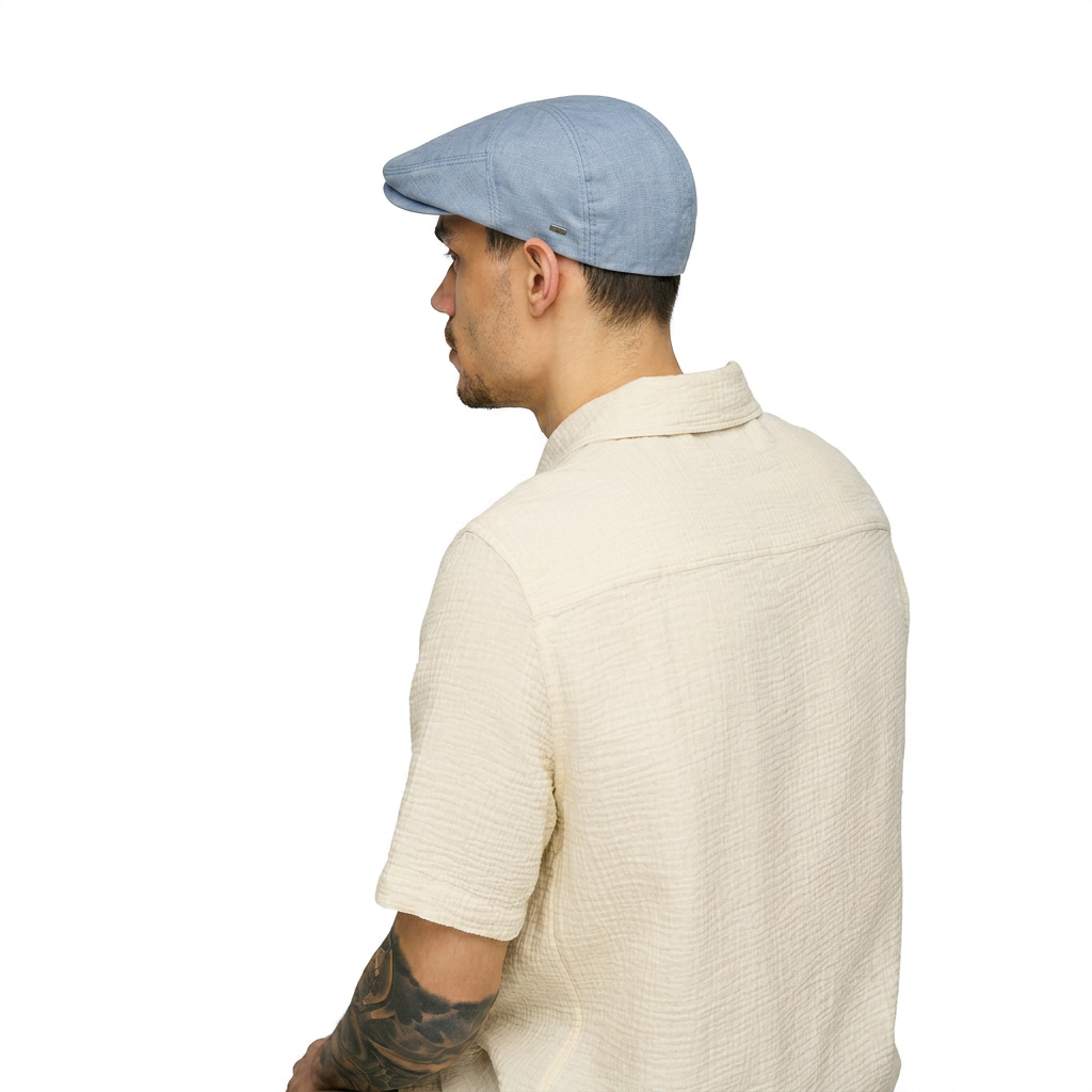 Roan Flat Cap Blue – back view on model wearing men's fully lined cotton blend ivy cap in blue