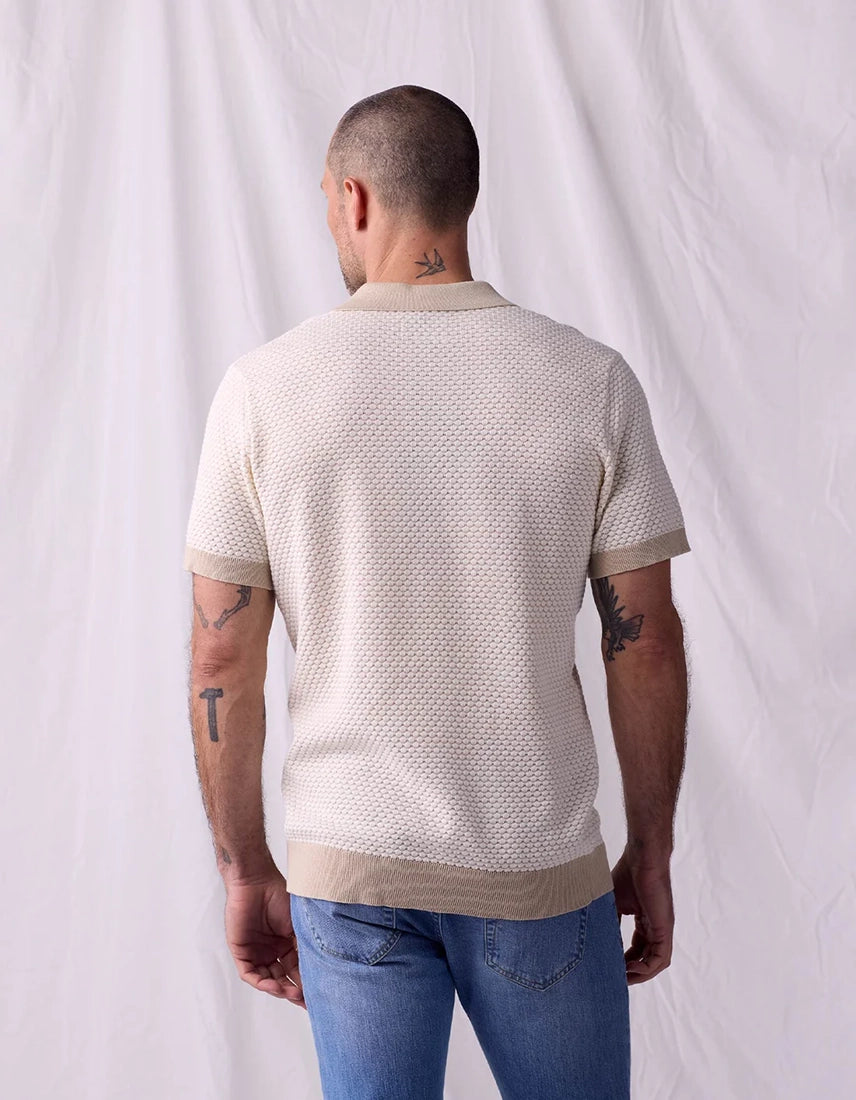 Back view of The Normal Brand Robles Knit Polo in ivory khaki – 100% cotton jacquard knit contrast rib cuffs and hem band men's short sleeve