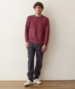 Man wearing Cabernet roll neck sweater with grey pants, full body front view - The Simple Man
