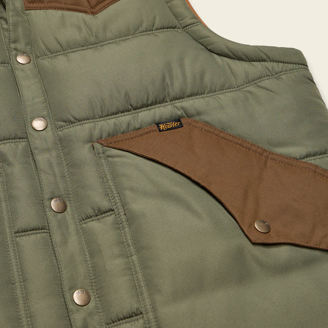 Howler Brothers Rounder Vest in Oregano/Cocoa – Close-up of snap chest pocket and logo tag – The Simple Man