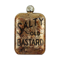 Close-up of Salty Old Bastard etched whiskey flask with aged patina finish – 6oz stainless steel men’s flask from The Simple Man