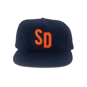 an Diego navy snapback hat with bold orange SD embroidered patch, flat brim, front view – The Simple Man