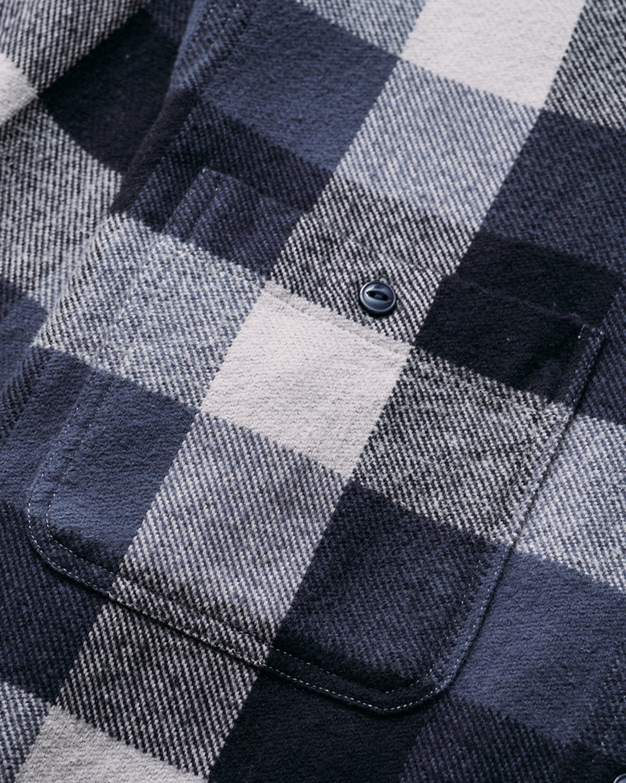 Detailed shot of chest pocket and button on buffalo check flannel shirt – heavy cotton fabric and stitching on premium men’s workwear at The Simple Man.