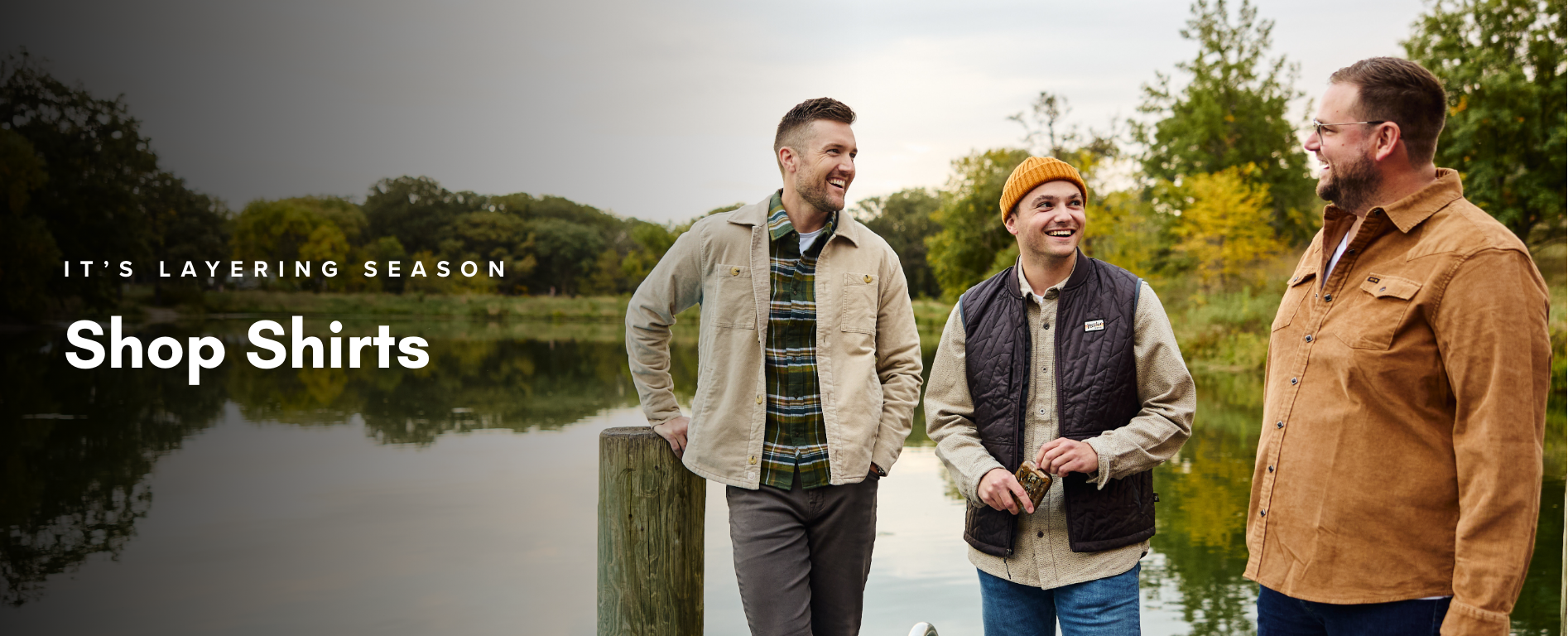 three men enjoying themselves at the lake wearing men's clothing outwear omaha