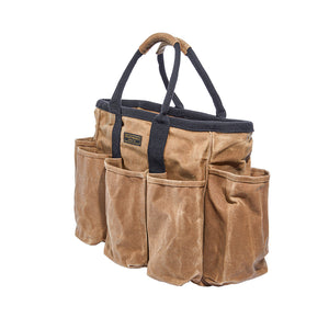 Readywares Supply Bag three-quarter view white background — 14-pocket 16oz waxed canvas tool tote with black cotton poly straps