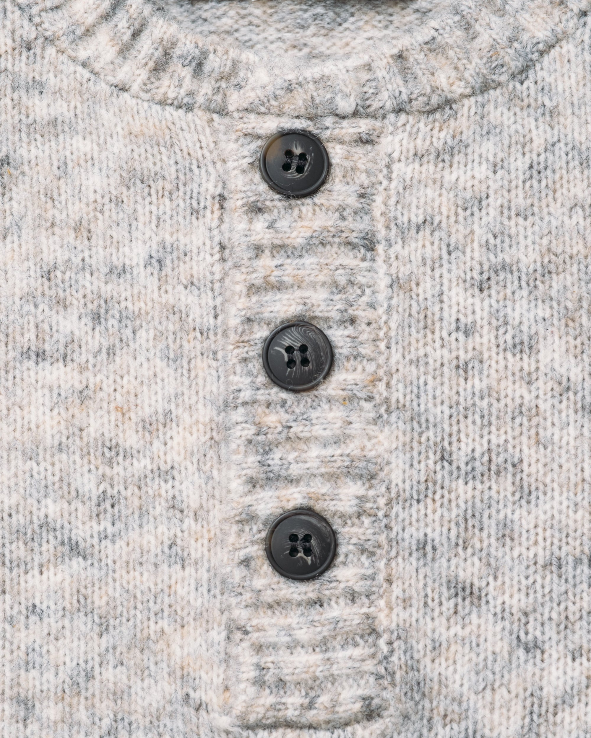 Close-up of the flecked heathered knit and buttons on the Cloud Grey tri-blend henley sweater - The Simple Man
