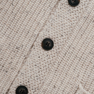 Shawl collar detail on an off white flecked Donegal wool blend cardigan - The Simple Man