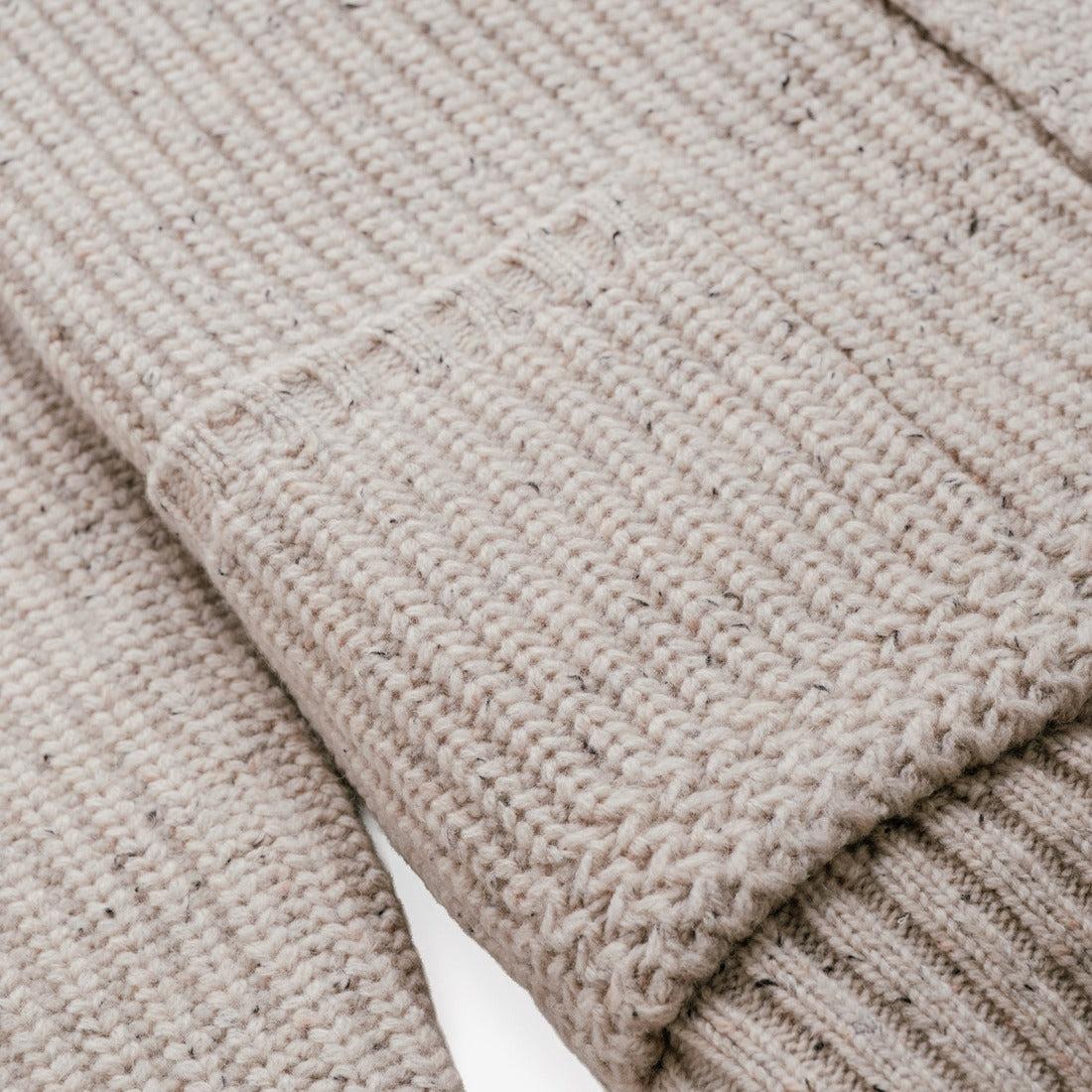 Five-button front detail on an off white ribbed Shaker knit cardigan - The Simple Man