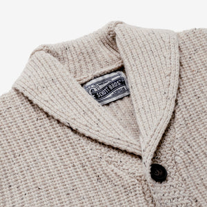 Lower front patch pocket detail on an off white Donegal-inspired wool cardigan - The Simple Man