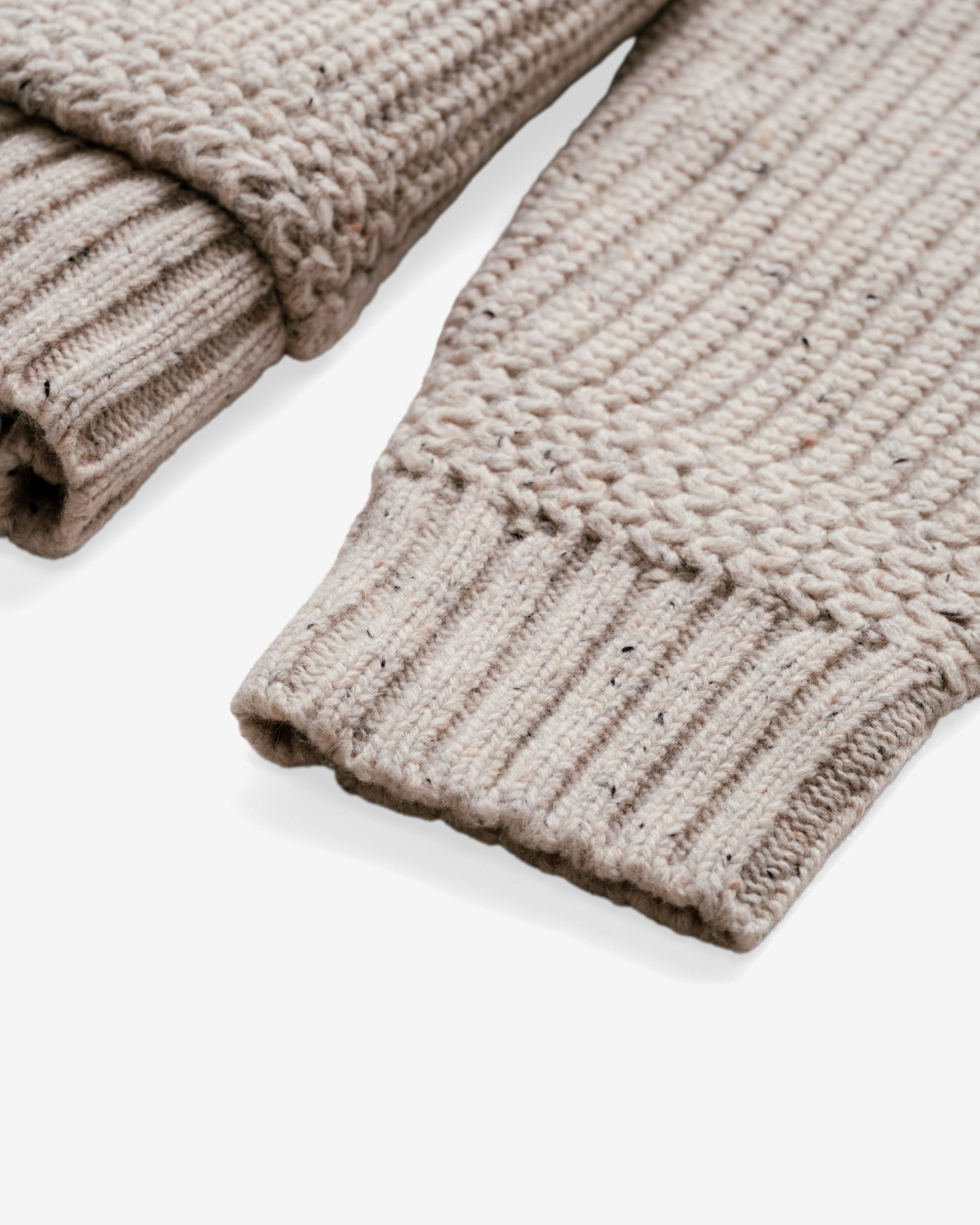 Ribbed cuff detail on an off white wool blend Donegal cardigan - The Simple Man