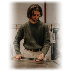 Man wearing a moss green midweight wool blend crewneck sweater, on model - The Simple Man