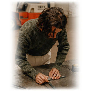 Moss green shaker knit crewneck sweater worn on model, side angle - The Simple Man
