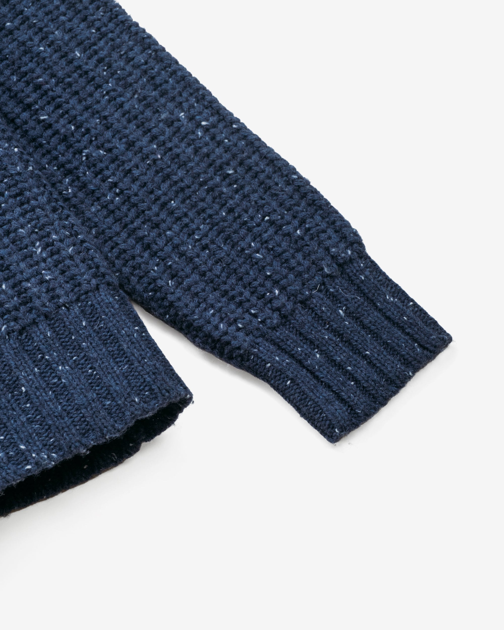 Close-up of the ribbed cuff and flecked wool blend knit on the navy Donegal pullover sweater - The Simple Man