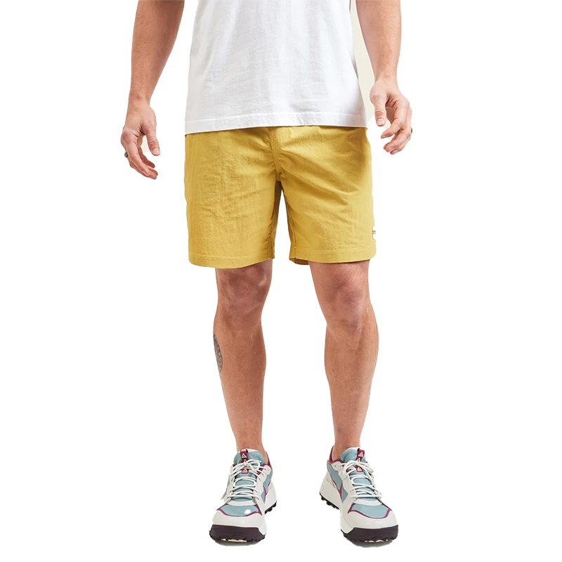 Model Wearing Howler Brothers Salado Shorts in Old Gold color, front  view