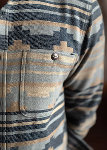 Close-up of jacquard cotton flannel fabric and metal button detail