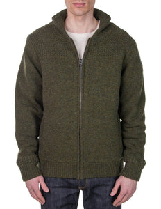 Man wearing Schott NYC moss green shawl collar wool sweater jacket, front zip, styled with jeans – rugged men's outerwear from The Simple Man