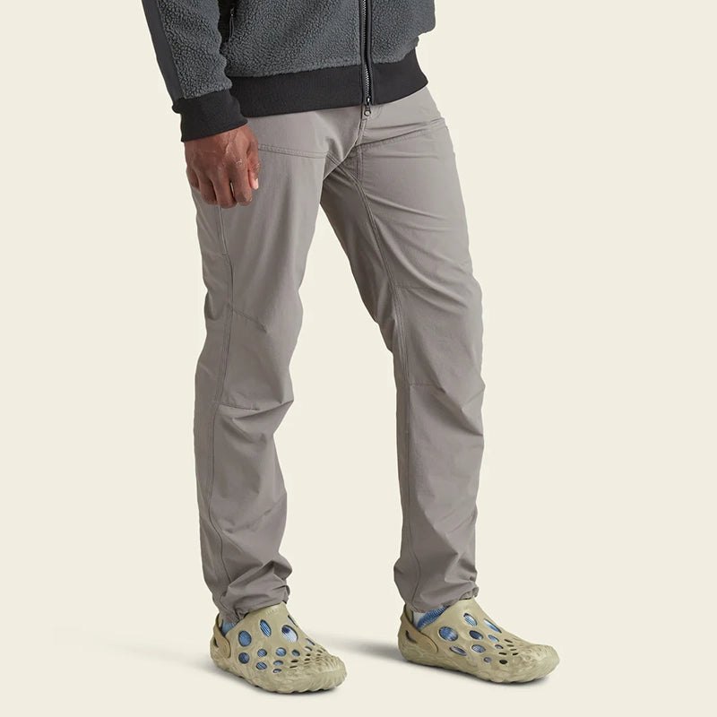 Model Wearing Howler Brothers Shoalwater Tech Pants in Grayling color, Front view