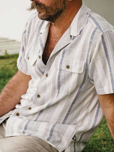 Howler Brothers Shores Club Shirt Old Bill Stripe Limestone lightweight cotton camp collar shirt for men lifestyle view