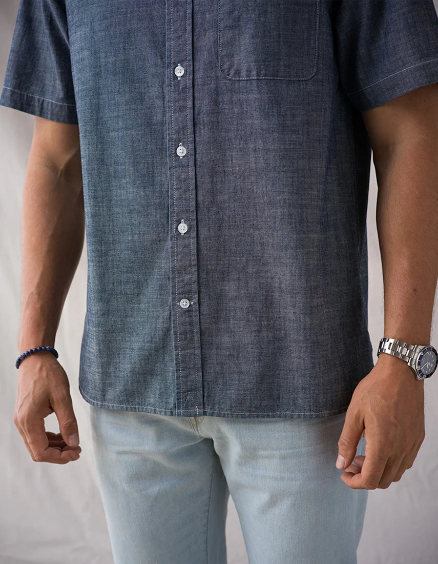 Ace Rivington Surplus Chambray Tailored Shirt Indigo Rinse mid-body view showing button placket tailored scoop hem and side gusset