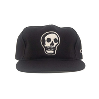 Black stadium serge snapback hat with embroidered skull patch, The Skull II, front view
