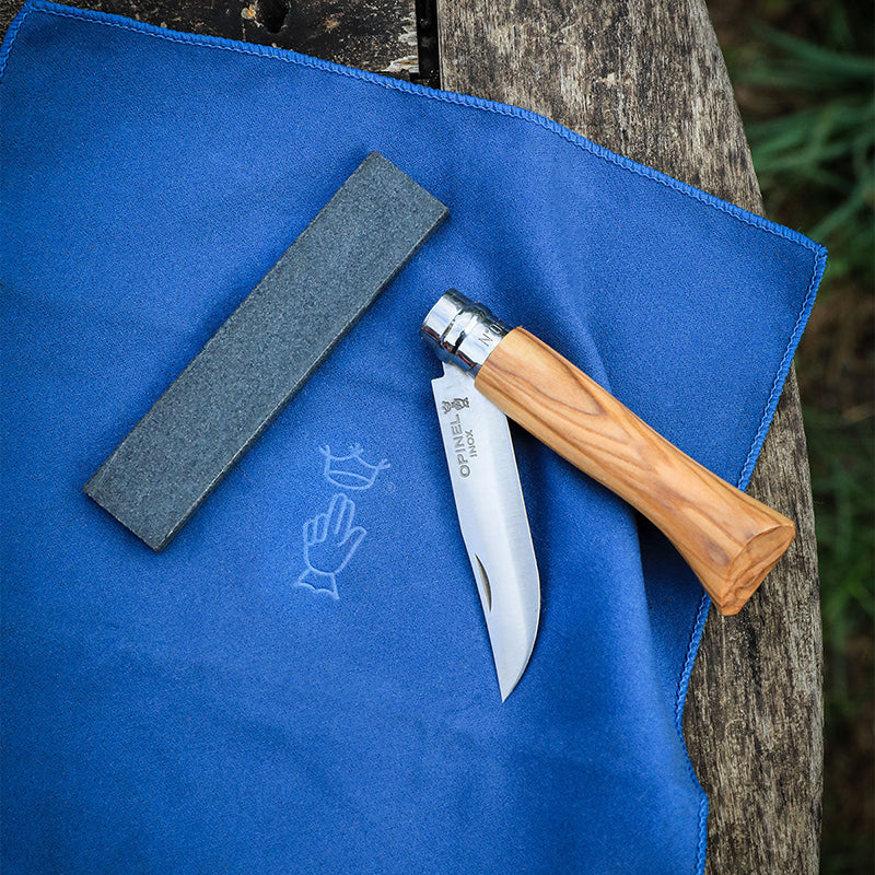 Lifestyle photo showing Opinel Natural sharpening stone and a knife