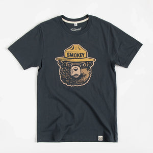 Smokey Bear Logo Tee in Dark Navy by The Landmark Project flat lay