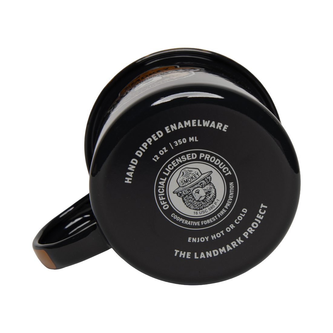 Underside of the navy enamel mug showing the 12 oz hand-dipped enamelware stamp