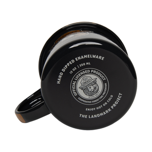 Underside of the navy enamel mug showing the 12 oz hand-dipped enamelware stamp