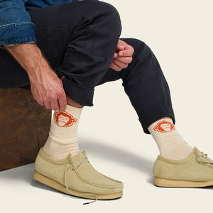 El Mono Socks in Sand Orange laid flat, cream crew socks with orange howler monkey graphic and striped toe -- The Simple Man
