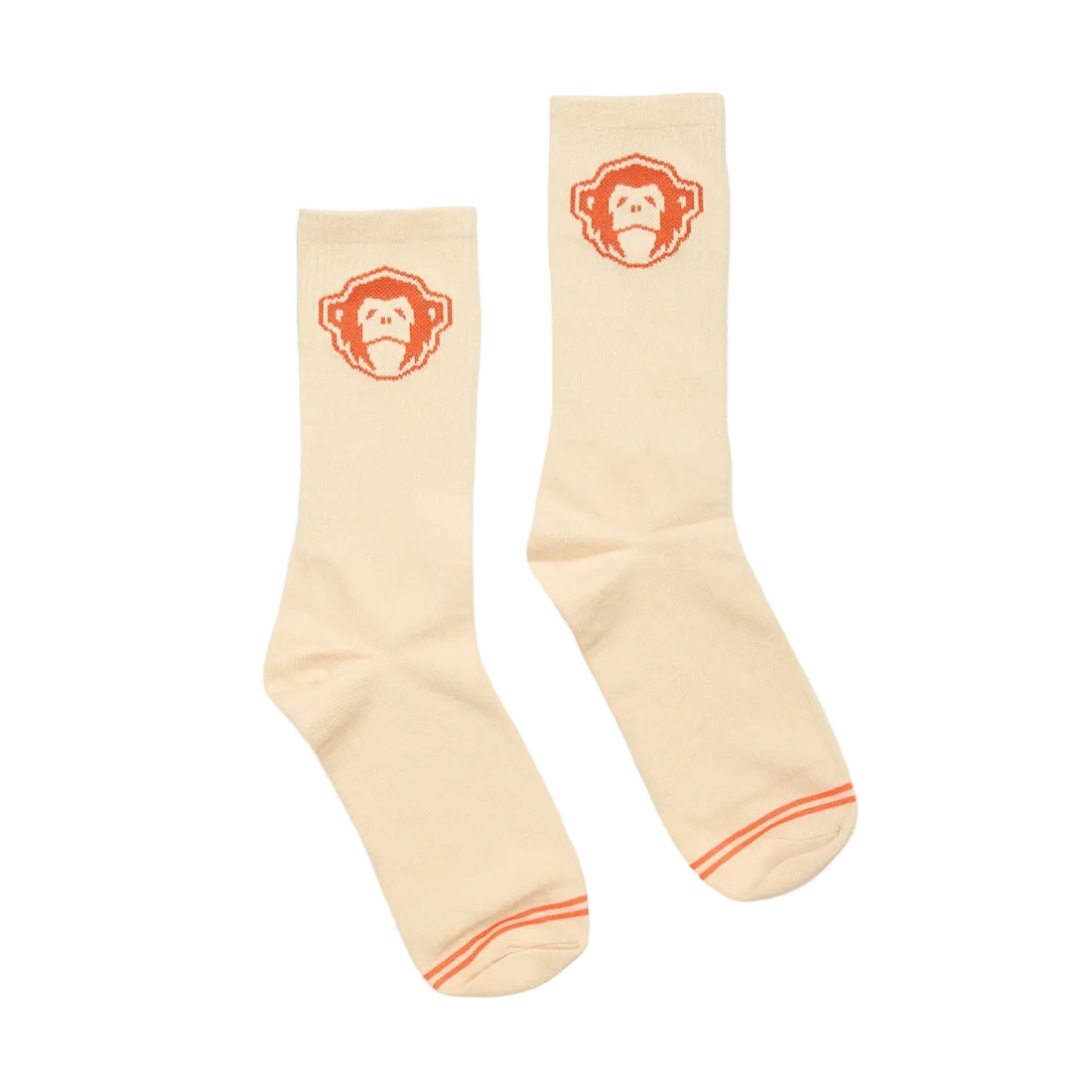 Man wearing El Mono Socks in Sand Orange with suede moc-toe shoes, cream crew socks with orange monkey graphic, lifestyle shot -- The Simple Man