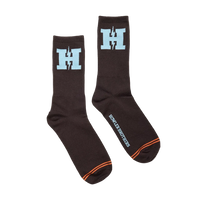H-Bolt Socks in Brown and Light Blue laid flat, dark brown crew socks with light blue H Bolt logo and Howler Brothers script on the sole -- The Simple Man
