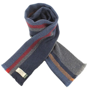 Soft Donegal wool scarf in navy with red and gray stripes, rolled to show texture and speckled Irish wool detail.