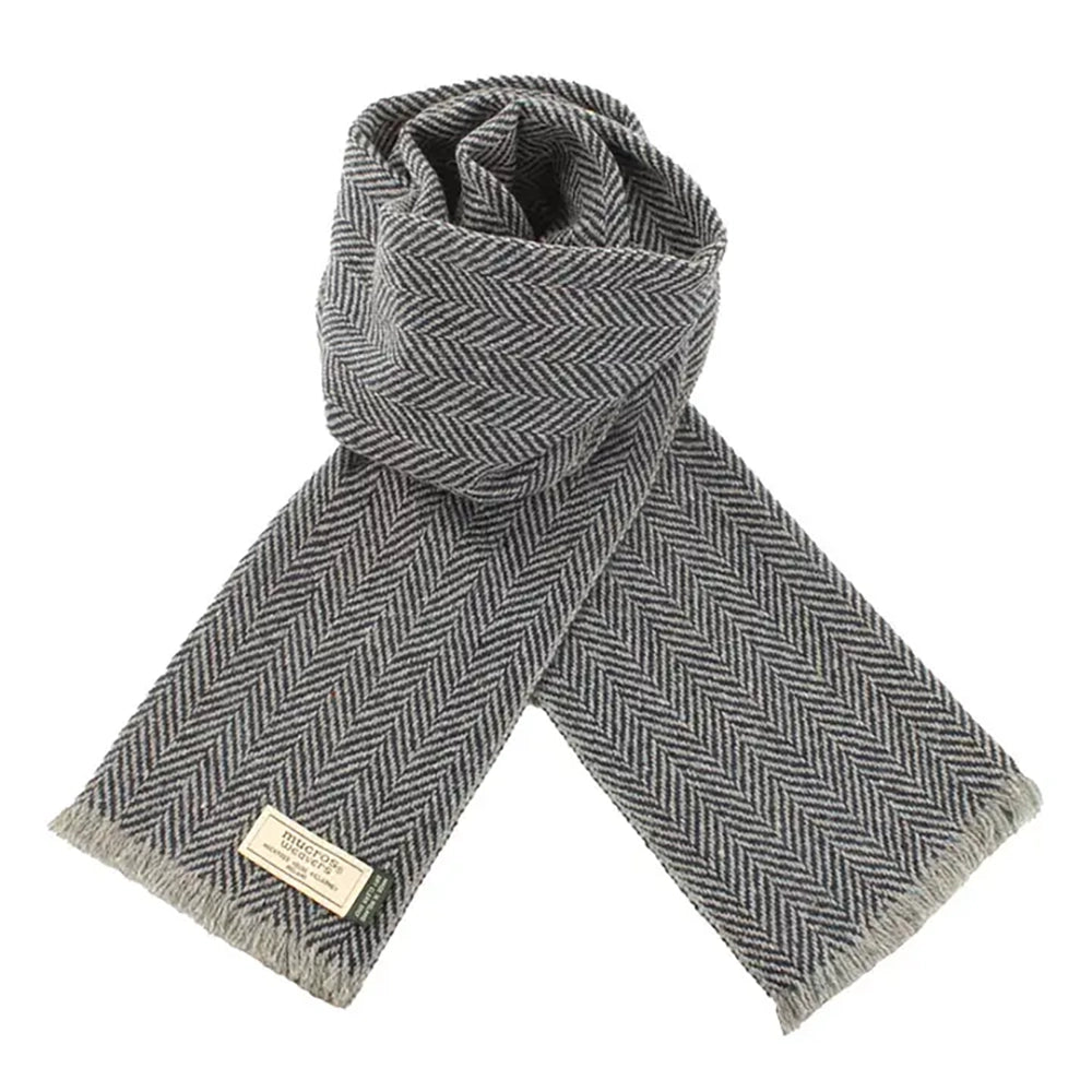 Grey and black herringbone Donegal wool scarf featuring soft Irish wool, subtle flecks, and finished fringe detailing