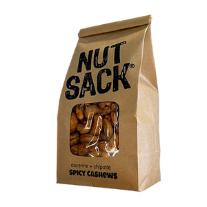 Kraft paper bag labeled 'Nut Sack' with spicy cashews on a white background 12oz