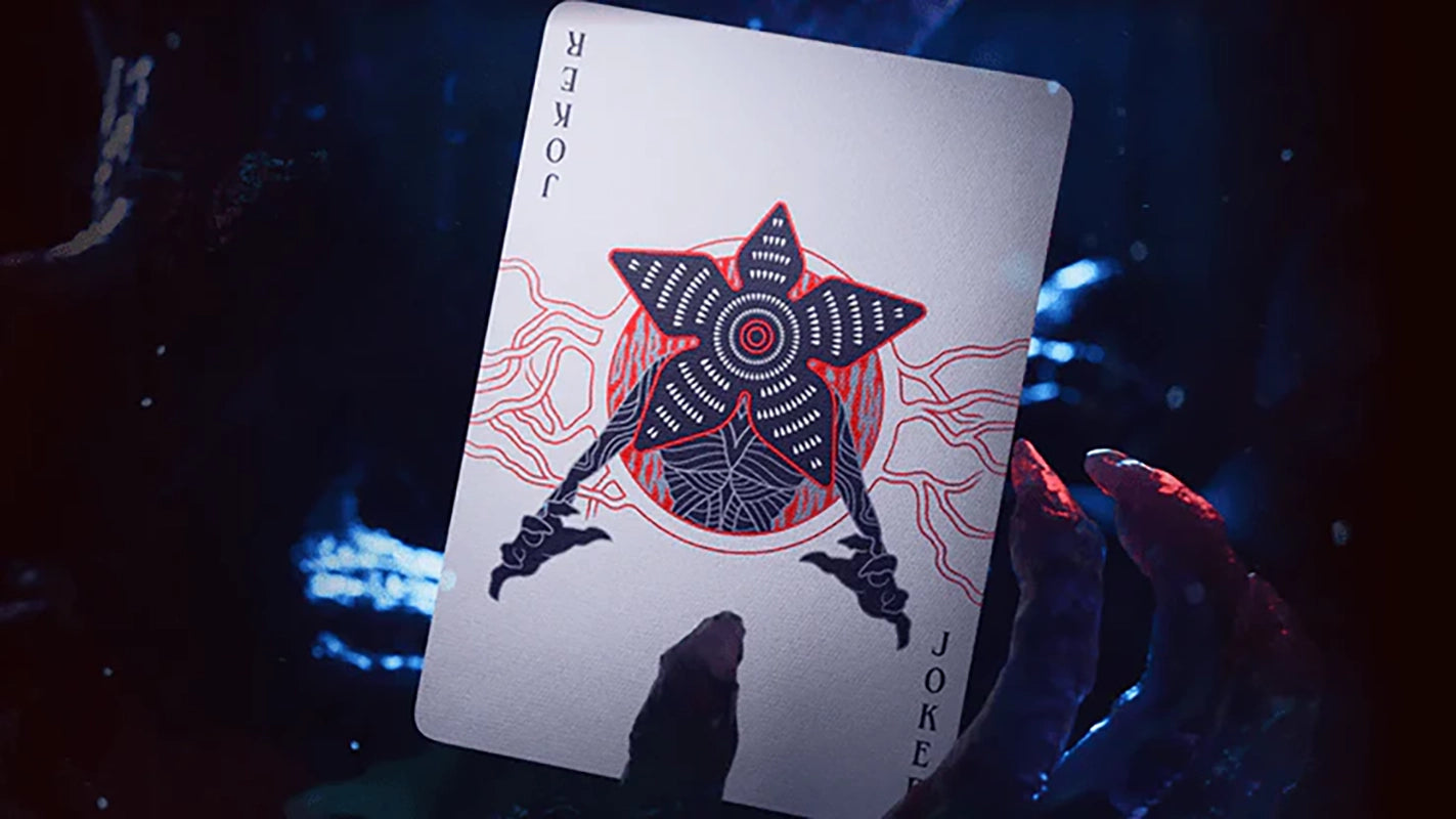 Theory11 Stranger Things Joker card with Demogorgon artwork, displayed in dramatic Upside Down lighting
