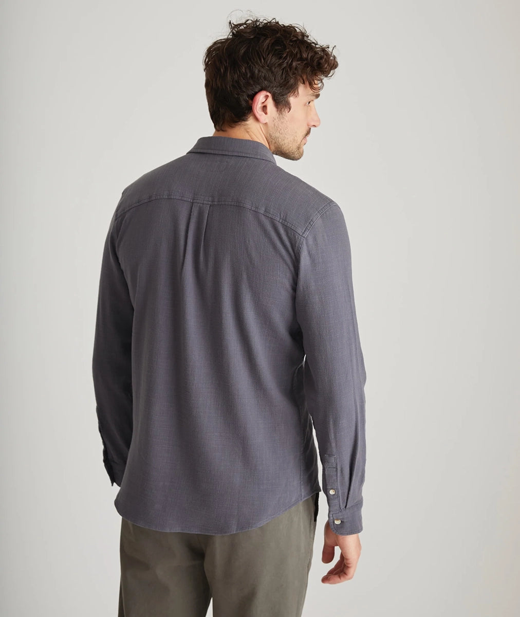 Back view of men’s long sleeve stretch selvage shirt in India Ink on model