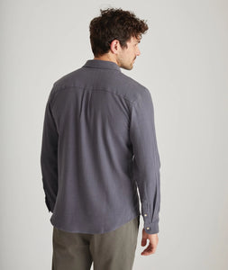Back view of men’s long sleeve stretch selvage shirt in India Ink on model